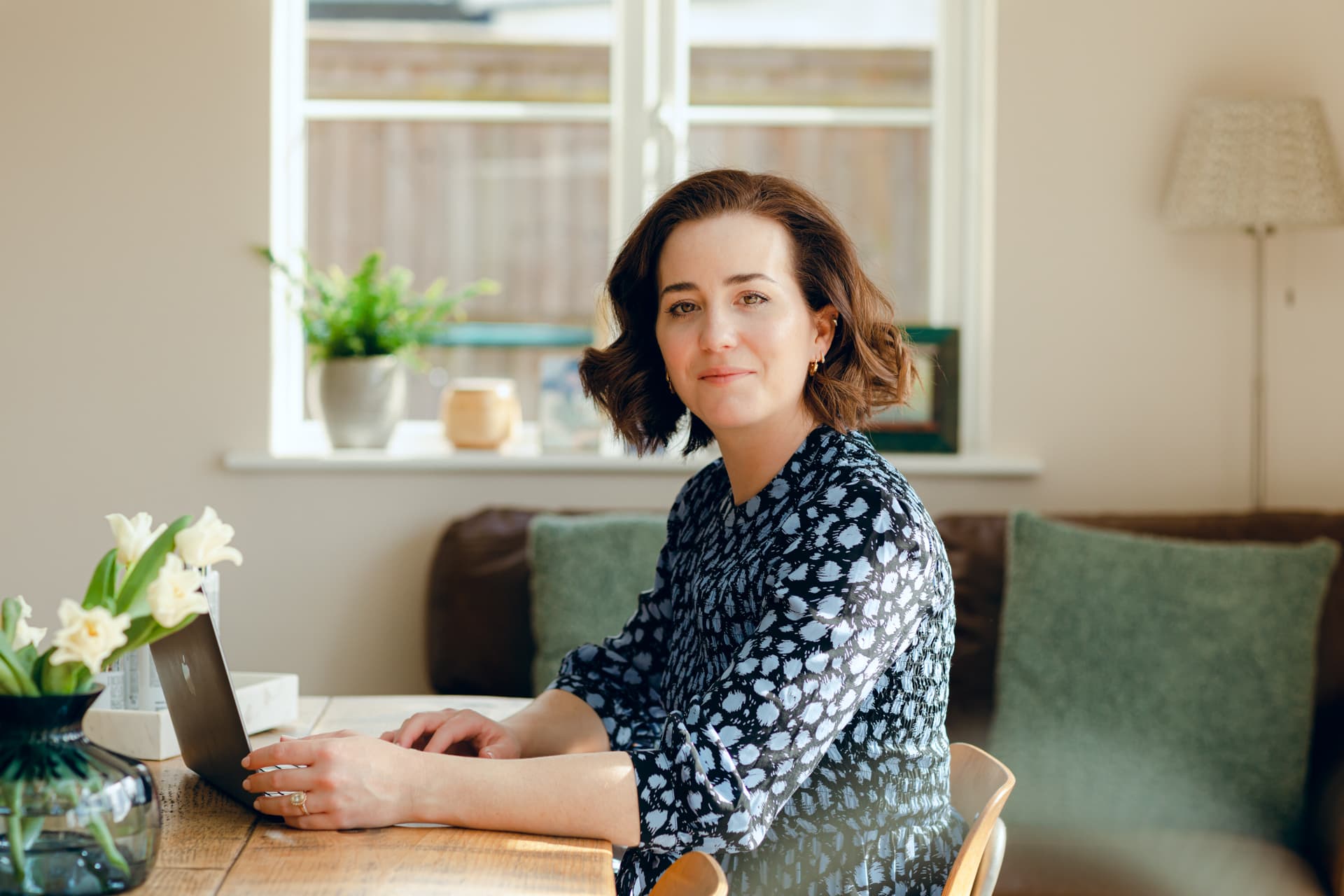 Stunning portrait of Jo Worthington, professional photographer, in a cosy home setting.