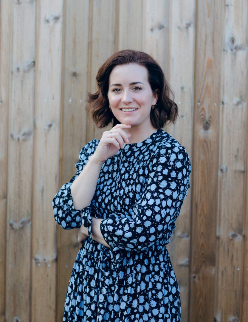 Elegant portrait of Jo Worthington in a stylish patterned dress outdoors in Bradford, showcasing professional photography skills.