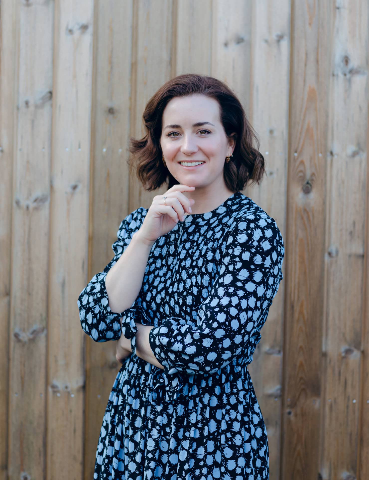 Elegant portrait of Jo Worthington in a stylish patterned dress outdoors in Bradford, showcasing professional photography skills.